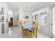 Bright dining area features tile flooring and a large window for plenty of natural light at 473 Tournament Dr, Spring Hill, FL 34608