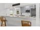 Charming kitchen featuring updated countertops, stainless steel appliances, and a breakfast bar with seating at 473 Tournament Dr, Spring Hill, FL 34608