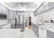 Bright kitchen featuring modern appliances, quartz countertops, and a subway tile backsplash at 473 Tournament Dr, Spring Hill, FL 34608