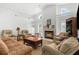 Inviting living room features a fireplace, vaulted ceiling, and lots of natural light at 473 Tournament Dr, Spring Hill, FL 34608