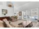 Bright living room with pool view, comfortable seating, and neutral decor at 473 Tournament Dr, Spring Hill, FL 34608