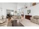 Spacious living room with neutral carpet, comfortable seating, and view to a dining space at 473 Tournament Dr, Spring Hill, FL 34608