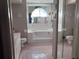 Main bathroom featuring a large soaking tub and a separate vanity area at 5045 Musselshell Dr, New Port Richey, FL 34655