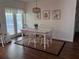 Bright dining area with view to the backyard and door to the patio at 5045 Musselshell Dr, New Port Richey, FL 34655