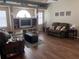 Spacious living room featuring hardwood floors and a built-in entertainment center at 5045 Musselshell Dr, New Port Richey, FL 34655