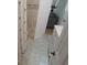 Bathroom featuring tiled shower and storage vanity at 545 Walden Ct, Dunedin, FL 34698