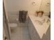 Bathroom featuring a vanity with a marble countertop, sink, and modern fixtures at 545 Walden Ct, Dunedin, FL 34698