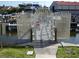 Secured community boat dock with boat lift and direct water access at 545 Walden Ct, Dunedin, FL 34698