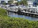 Private boat dock provides a serene view of the water and the community at 545 Walden Ct, Dunedin, FL 34698