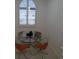 Bright dining nook features a modern pendant light and window with shutters at 545 Walden Ct, Dunedin, FL 34698