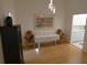 Dining area featuring hardwood floors, modern light fixture, and bright art at 545 Walden Ct, Dunedin, FL 34698