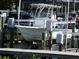 A boat on a lift, highlighting the property's boating and waterfront lifestyle at 545 Walden Ct, Dunedin, FL 34698