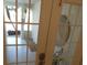 Cozy entryway featuring decorative gravel and lush greenery just beyond the glass paned doors at 545 Walden Ct, Dunedin, FL 34698