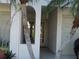 Charming exterior of a home with palm trees enhancing curb appeal near the front entry at 545 Walden Ct, Dunedin, FL 34698