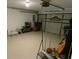Spacious garage featuring storage racks, ample room for vehicles, and overhead lighting at 545 Walden Ct, Dunedin, FL 34698