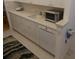 Kitchen features new appliances and granite counters at 545 Walden Ct, Dunedin, FL 34698