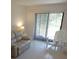 Bright living room with comfortable seating and natural light at 545 Walden Ct, Dunedin, FL 34698