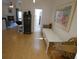 Inviting living room featuring hardwood floors, stylish furniture, and an open layout leading to the kitchen and other living areas at 545 Walden Ct, Dunedin, FL 34698