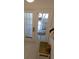 Patio door providing light and outdoor access to seating area at 545 Walden Ct, Dunedin, FL 34698