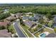 Overhead perspective of the property showcasing its proximity to green spaces, nearby homes, and neighborhood streets at 6109 Japonica Ct, New Port Richey, FL 34655