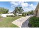 Spacious backyard offers a brick-paved area with a decorative design, ideal for entertaining and outdoor enjoyment at 6109 Japonica Ct, New Port Richey, FL 34655