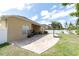 Expansive backyard featuring a paved patio, lush lawn, and a basketball hoop for outdoor fun at 6109 Japonica Ct, New Port Richey, FL 34655