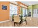 Inviting dining area with modern table setting and sliding glass door access at 6109 Japonica Ct, New Port Richey, FL 34655