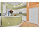 Well-appointed kitchen with white cabinetry, breakfast bar, and contemporary appliances for the home chef at 6109 Japonica Ct, New Port Richey, FL 34655