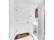 Efficient laundry room featuring a washer, dryer, storage cabinet, and access to outdoors at 6109 Japonica Ct, New Port Richey, FL 34655