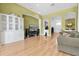 Spacious living room showcasing beautiful wood floors, archways, and a built-in display cabinet at 6109 Japonica Ct, New Port Richey, FL 34655