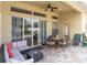 Relaxing patio area with brick pavers, outdoor furniture, and view of the backyard at 6109 Japonica Ct, New Port Richey, FL 34655