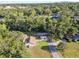 Lush greenery surrounds a charming neighborhood with mature trees, offering a serene and private setting at 7101 N 18Th St, Tampa, FL 33610