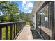 Relaxing outdoor balcony offers stunning views of the sky and lush tropical trees at 7101 N 18Th St, Tampa, FL 33610