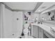 Bright bathroom with shower and vanity complemented by contemporary art adds charm and function at 7101 N 18Th St, Tampa, FL 33610