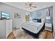 Cozy bedroom features contemporary decor, soft colors, natural light and a plush rug, offering a tranquil escape at 7101 N 18Th St, Tampa, FL 33610
