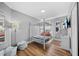 Neutral-toned bedroom with stylish bunkbeds, hardwood floors and a cozy beanbag, perfect for  at 7101 N 18Th St, Tampa, FL 33610