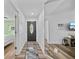 The spacious entryway features modern floors and offers seamless access to the rest of this beautiful home at 7101 N 18Th St, Tampa, FL 33610