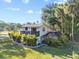 Charming two-story home with a screened-in pool area and a spacious deck overlooking the landscaped yard at 7101 N 18Th St, Tampa, FL 33610