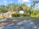 Enjoy the mature trees and landscaping surrounding this property with room to park your RV or boat at 7101 N 18Th St, Tampa, FL 33610