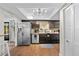 Kitchen with stainless steel appliances, granite countertops, and wooden flooring at 7101 N 18Th St, Tampa, FL 33610
