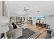 The open living room with modern decor offers lots of natural light and an easy transition to the dining area at 7101 N 18Th St, Tampa, FL 33610
