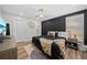 Stylish main bedroom featuring a modern accent wall, plush bed, and contemporary decor at 7101 N 18Th St, Tampa, FL 33610