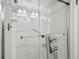 This bathroom features a modern glass-enclosed shower with sleek hardware and neutral-toned tiling at 7427 Baltusrol Dr, New Port Richey, FL 34654