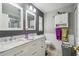 Elegant bathroom featuring dual sinks, marble countertops, and modern fixtures at 7427 Baltusrol Dr, New Port Richey, FL 34654