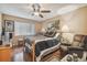 Inviting bedroom with a ceiling fan, lots of natural light, and a relaxing ambiance at 7427 Baltusrol Dr, New Port Richey, FL 34654