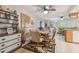 Dining area with a decorative cabinet and views of the living room at 7427 Baltusrol Dr, New Port Richey, FL 34654