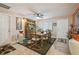 Dining area with a hutch, ceiling fan, and access to other living spaces at 7427 Baltusrol Dr, New Port Richey, FL 34654