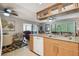 Bright kitchen featuring granite countertops, stainless appliances, and ample cabinet space at 7427 Baltusrol Dr, New Port Richey, FL 34654
