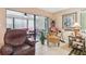 Cozy living room featuring a comfortable seating area and access to a sunroom at 7427 Baltusrol Dr, New Port Richey, FL 34654