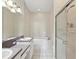 Bright bathroom with a double vanity, a soaking tub, and a separate shower room at 7427 Wimpole Dr # 7427, New Port Richey, FL 34655